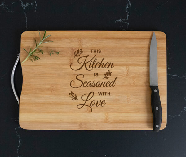 this kitchen is seasoned with love chopping board